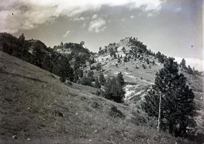 black and white photograph of mountain landscape from valley