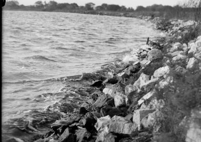 black and white photograph of water and shoreline