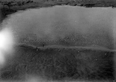 black and white photograph of saline pool shoreline