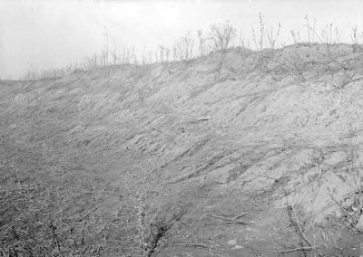 black and white photograph of clay slope