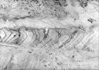 black and white photograph of sand stratification