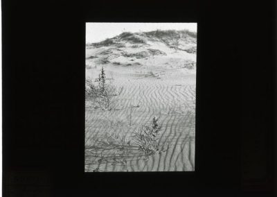 black and white photo of sand ripples in landscape