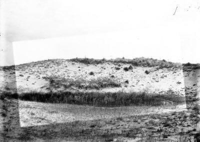 black and white sand hill bluff with sparse grass